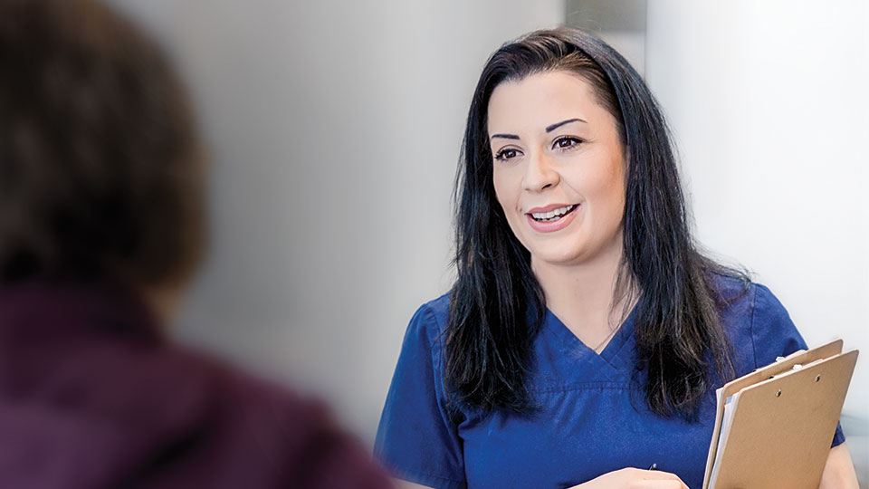 A women getting a patient in a medical office