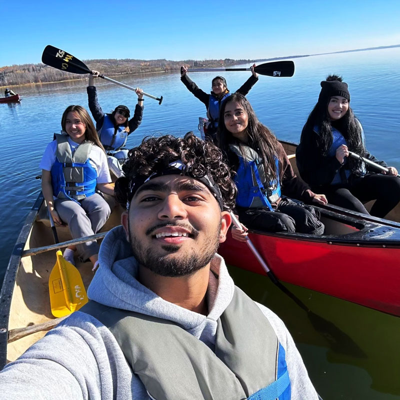 A group of students enjoying canoeing